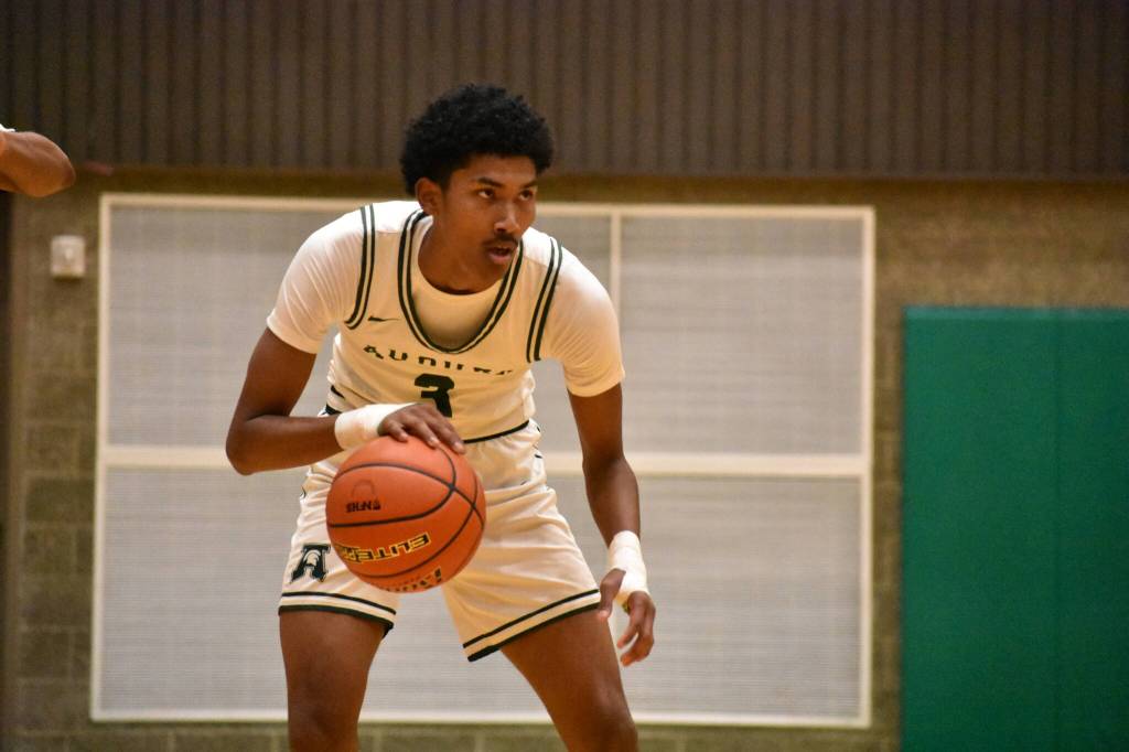 Daniel Johnson eyes down the defense against Kentwood inside the Bob Jones Gymnasium. Ben Ray / The Reporter