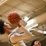 Isaiah Englund fades away from the basket against Kentwood. Ben Ray / The Reporter