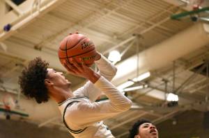 Isaiah Englund fades away from the basket against Kentwood. Ben Ray / The Reporter