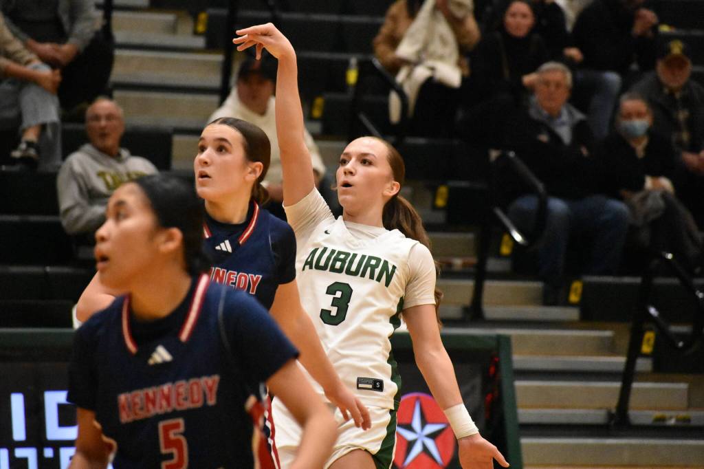 Avery Hansen takes a three point shot against Kennedy Catholic. Ben Ray / The Reporter
