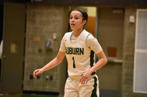 Jordyn Schoenbachler sticks her tongue out after making a three for Auburn. Ben Ray / The Reporter