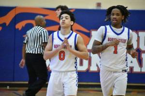 Kolven Posey (left) and Markel Lowery (right) react to the win in overtime. Ben Ray / The Reporter