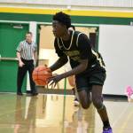 Leroy Kinnay drives to the basket. Ben Ray / The Reporter