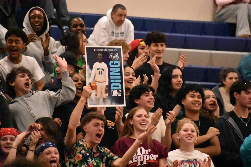 On his senior night, Auburn Riverside students hold a Diing Diing poster. Ben Ray / The Reporter