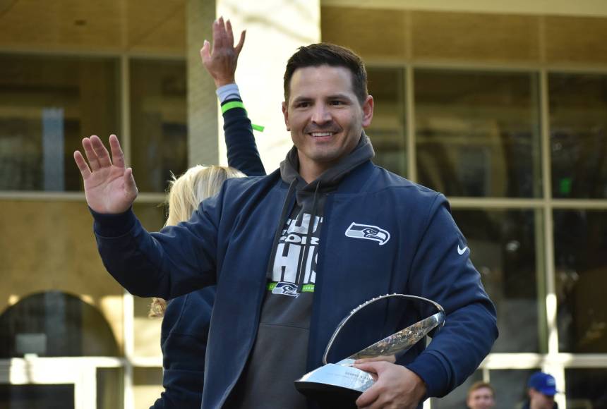 <p>Seahawks head coach Mike Macdonald waves and holds the Lombardi Trophy during the parade. Photos by Ben Ray / Sound Publishing</p>
