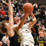 Isaiah Englund throws up a shot against Puyallup. Ben Ray / The Reporter