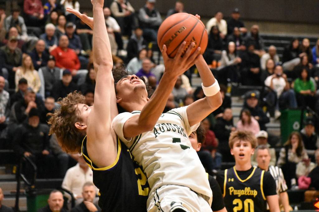 Isaiah Englund throws up a shot against Puyallup. Ben Ray / The Reporter