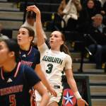 Avery Hansen takes a three point shot against Kennedy Catholic. Ben Ray / The Reporter