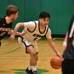 Evan Thompson dribbles the basketball for Muckleshoot against Garfield-Palouse. Ben Ray / The Reporter