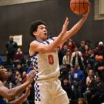 Auburn Mountainviews Kolven Posey leaps in the air for a layup against Mountain View. Ben Ray / The Reporter