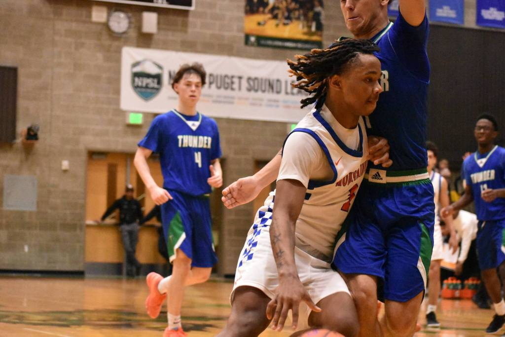 Auburn Mountainviews Markell Lowery drives to the basket against Mountain View. Ben Ray / The Reporter