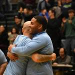 Auburn Mountainview head coach Kendall White hugs an assistant following the win. Ben Ray / The Reporter