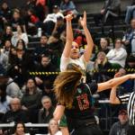 Jordyn Schoenbachler takes a three pointer in front of a full house. Ben Ra / The Reporter