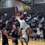 Auburn junior Isaiah Englund dunks the basketball. Nathan Hyun/For The Reporter