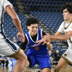 Kolven Posey drives to the basket through a Bellevue defender. Ben Ray / The Reporter