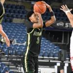 Daniel Johnson takes a 3-pointer against West Valley for Auburn inside the Tacoma Dome. Ben Ray / The Reporter