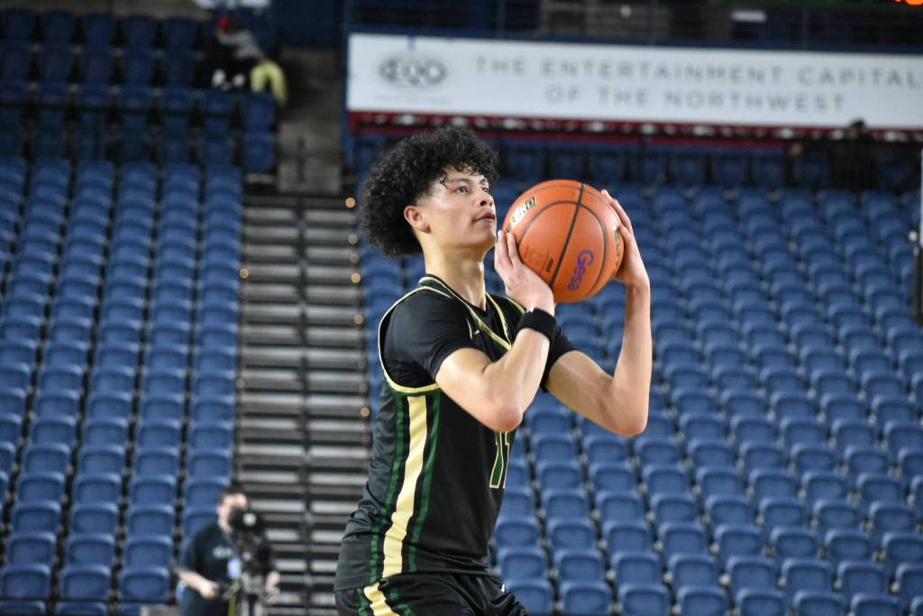 Matthew Fredrickson takes a jump shot against West Valley inside the Tacoma Dome. Ben Ray / The Reporter