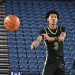 Daniel Johnson makes a pass inside the Tacoma Dome in the second half against West Valley. Ben Ray / The Reporter