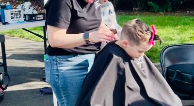 Courtesy photo
In this file photo, Bella Red Salon and Third Dimension Salon of Auburn teamed up in 2025 to provide 64 free haircuts to children in Auburn. About a dozen hairstylists between the two salons donated their time and talent to do the haircuts. The event was also a donation drop-off site to benefit the Auburn Valley Humane Society.