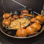 Rolling Smoke BBQ brisket sandwich, with coleslaw, pickles and crispy onions on a brioche bun, surrounding thier BBQ loaded mac and cheese. Photo by Bailey Jo Josie/Sound Publishing