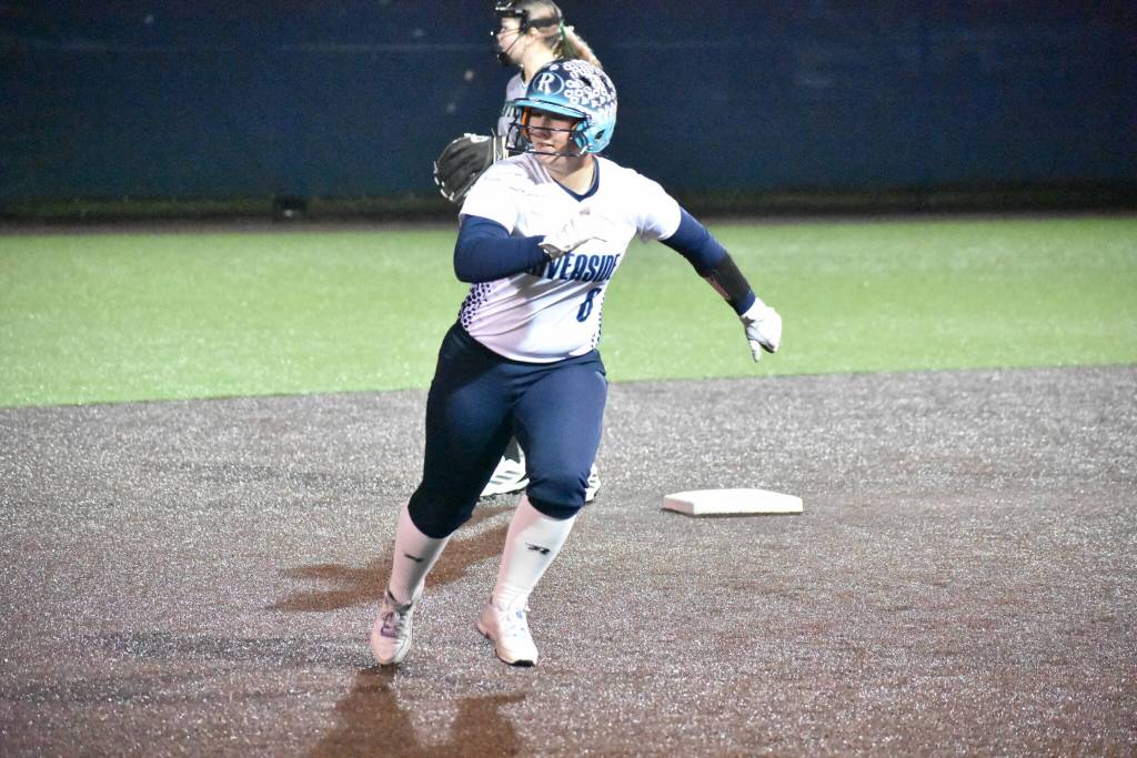 Katelyn Taylor runs to third base for Auburn Riverside. Ben Ray / The Reporter