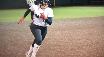 Olivia Olson runs to third base for Auburn Riverside. Ben Ray / The Reporter