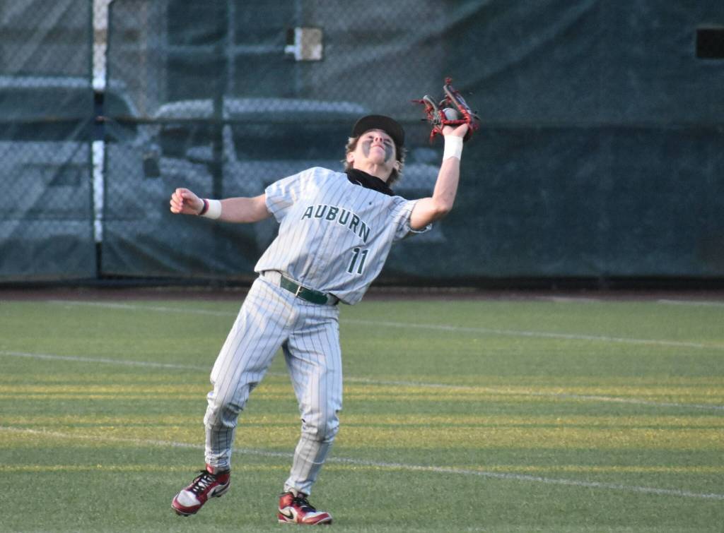Jayden Pierce catches a pop up at shortstop for Auburn. Ben Ray / The Reporter