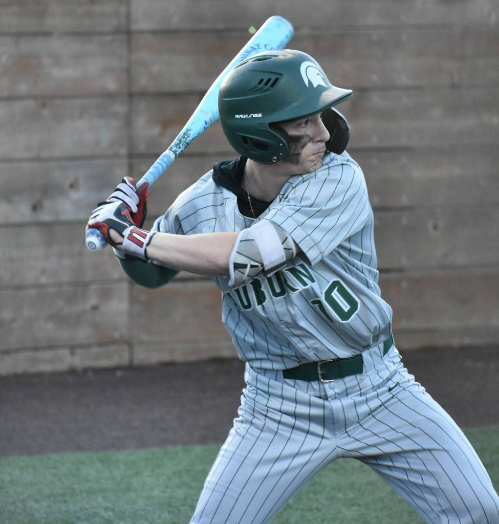 Johnathan Schumaier takes a swing for Auburn against Mount Rainier. Ben Ray / The Reporter