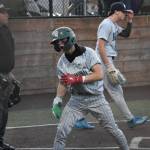 Jayden Pierce yells after scoring a run. Ben Ray / The Reporter