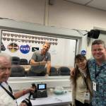 On the day before the Artemis II launch: Mercer Islands Bill Wiseman, right, with his wife Diana and his father Bill with NASA astronaut and commander Reid behind glass. Photo courtesy of Bill Wiseman