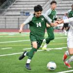 Emiliano Rodriguez fights for the ball against Mount Rainier. Ben Ray / The Reporter