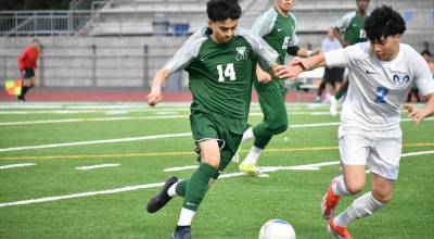 Emiliano Rodriguez fights for the ball against Mount Rainier. Ben Ray / The Reporter