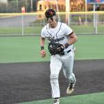 Lincoln Moore runs off the field after making a play at third base for Kentlake. Ben Ray / The Reporter