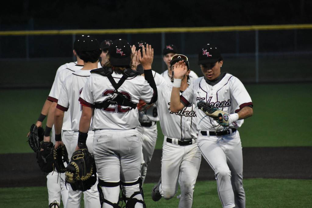 Kentlake players high-five following the win over Auburn Mountainview. Ben Ray / The Reporter
