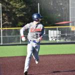 Logan Eckert runs to third base for Auburn Mountainview. Ben Ray / The Reporter