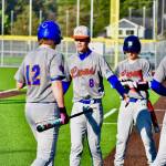 The Lions celebrate runs coming across to score. Ben Ray / The Reporter
