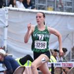 Maddie Hughes runs in the 300 Hurdle race for Kentwood. Ben Ray / Sound Publishing