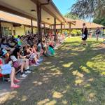 Family and friends celebrate bridging. Courtesy Photo, Param Simons