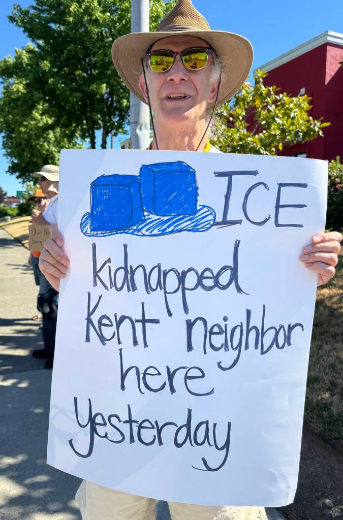 Protesters from Indivisible Covington and Indivisible Kent showed up June 14 along 104th Avenue SE after ICE arrested a Mexican man June 13 in the Saars Super Saver Foods parking lot. COURTESY PHOTO, Indivisible Covington/Kent
