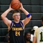 Tahomas Jake Moen holds the ball over his head for Tahoma. Ben Ray / The Reporter